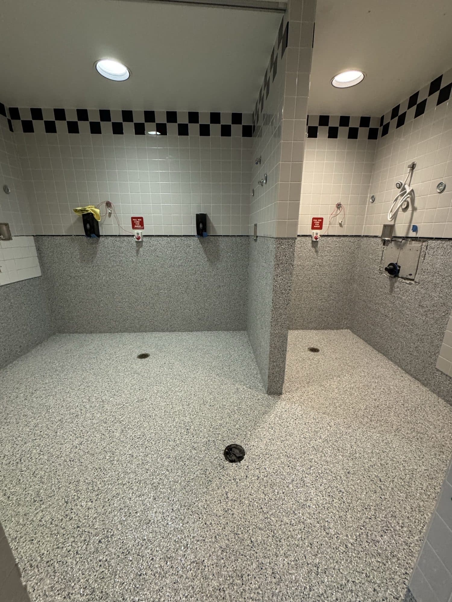 Flake system on floors and walls of a commercial wet room