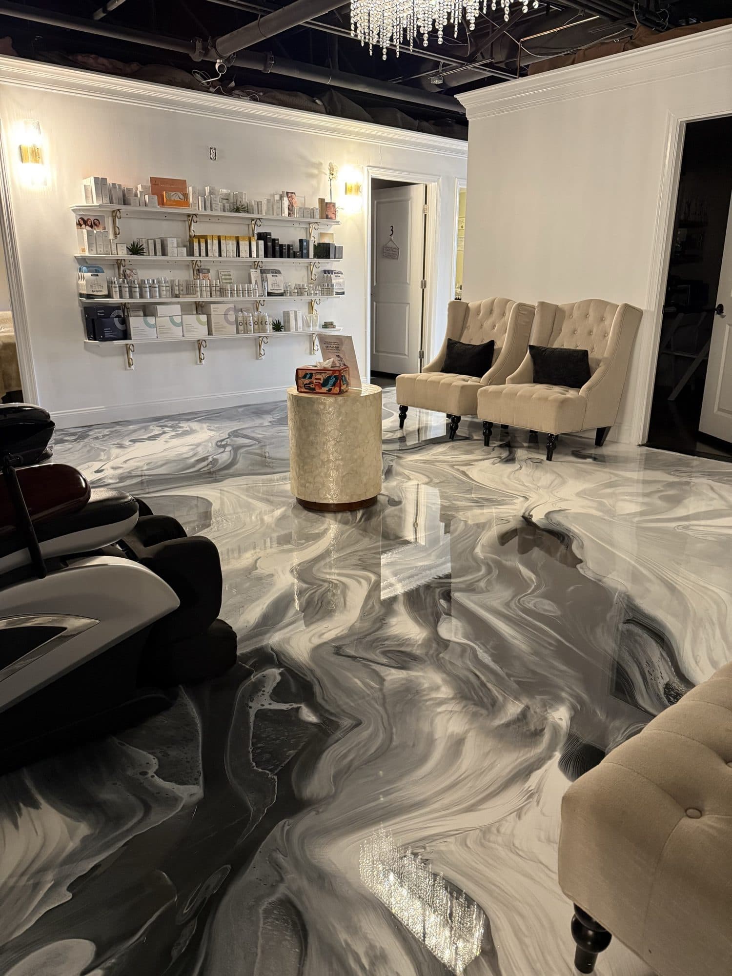 Gray and white metallic epoxy floor in a furnished salon